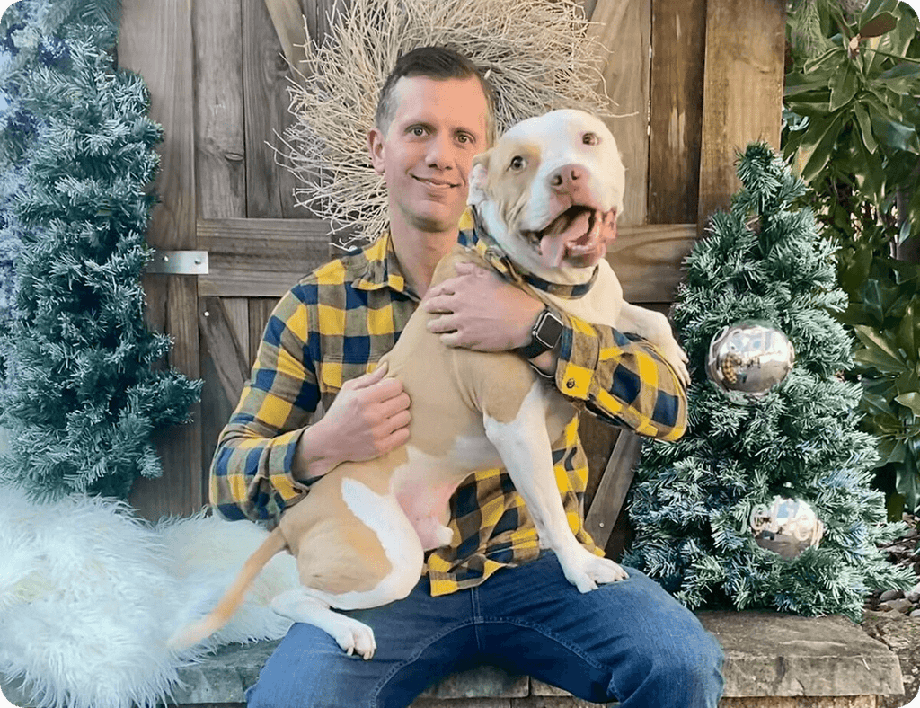 Brian, the founder of Bully Bows, and his rescue pit bull, Kaighn